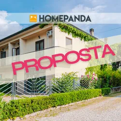 Porzione di bifamiliare con ampi spazi, terrazza, giardino e negozio e magazzino